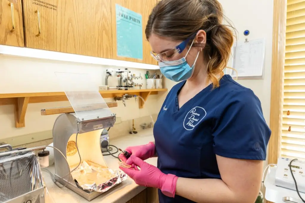 Cosmetic Dentistry in North Royalton, OH Shows our team working on a set of cosmetic dental implants.
